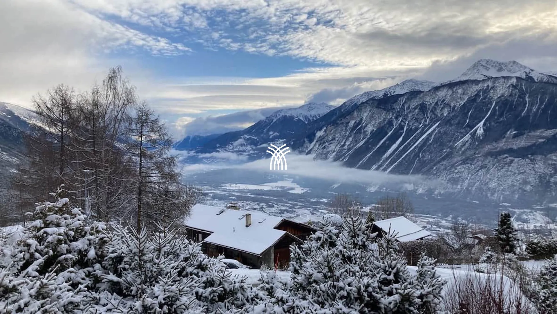 Snowy panorama over the Rhône valley and the Alps from Chalet Cervo